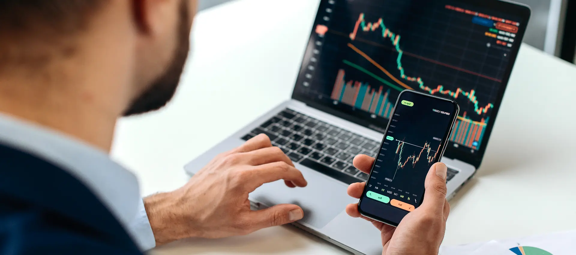 Trader working on laptop